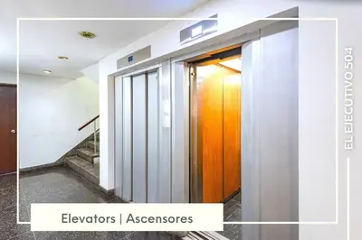 a hallway with a wooden door in a building at Vibrant Exclusive 1BR Apt in front of Casa Andina in Lima