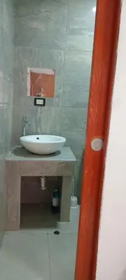 a bathroom with a white sink and a counter at Colibri in Lima