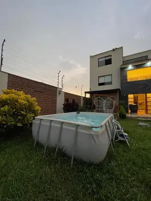 a bath tub in the yard of a house at Casa Huertos CIENEGUILLA in Cieneguilla