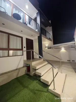 a staircase in a house with green grass at Casa de campo en condo cerca a playa Puerto Viejo in San Antonio