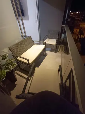 a room with two chairs and a glass table at Rosita del Mar in San Bartolo
