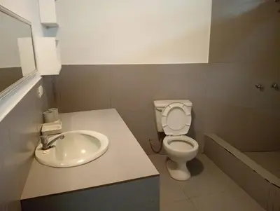 a bathroom with a toilet and a sink at Casa EN ASIA in Asia