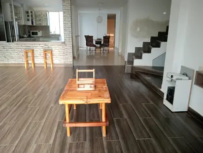 a wooden table in the middle of a room at Casa EN ASIA in Asia