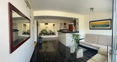 a living room with a couch and a counter at Boulevard Hotel in Asia