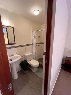a bathroom with a toilet and a sink at Boulevard Hotel in Asia