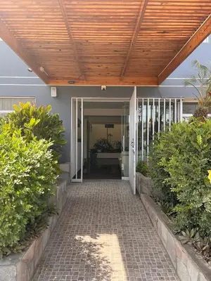 a porch with a wooden ceiling and a walkway at Boulevard Hotel in Asia