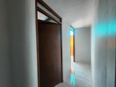 a wooden door in a room with a hallway at Casa Mirador SanBlas Quilla in Cusco