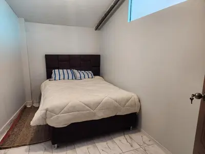 a small bedroom with a bed in a room at Casa Mirador SanBlas Quilla in Cusco
