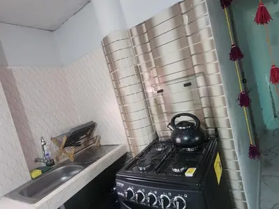 a tea kettle on top of a stove in a kitchen at Casa Mirador SanBlas Quilla in Cusco