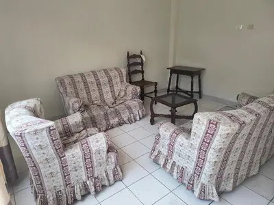 a living room with two couches and a table at Dpto Familiar en San Bartolo in San Bartolo