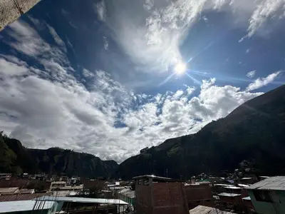 a view of a city with the sun in the sky at Sol de América in La Unión
