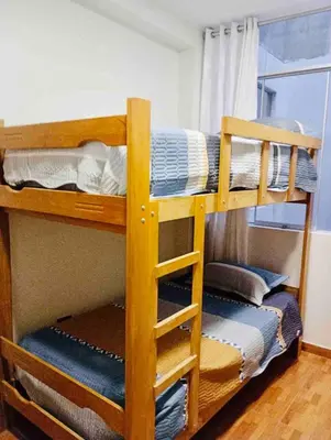 a couple of bunk beds in a room at Exclusivo Depa Cerca Precio Uno para 10 in La Merced