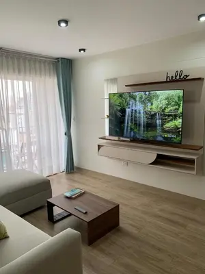 a living room with a large flat screen tv at Full Depa en Miraflores in Lima