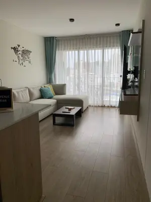 a living room with a couch and a table at Full Depa en Miraflores in Lima