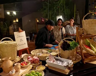 a group of people standing around a table with food at Union Hotel Cusco in Cusco