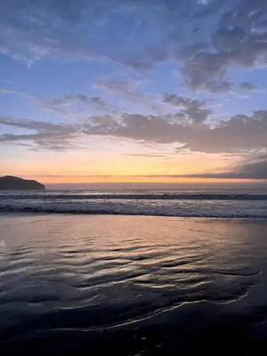a view of the beach at sunset at Casa de Playa Hawi in San Antonio