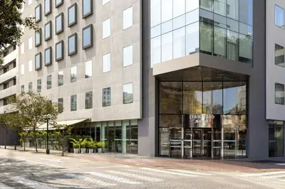 a building on a street with a store at Courtyard by Marriott Lima Miraflores in Lima