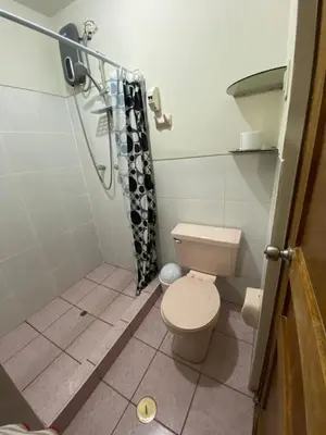 a bathroom with a toilet and a shower at Family-friendly apartment! in Cusco