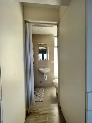 a bathroom with a sink and a toilet at Miraflores Mini Apartment in Lima