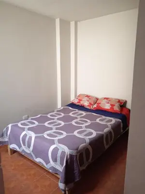 a bedroom with a bed in a room at Casa Halcones Huachipa Familia & Eventos in Lima