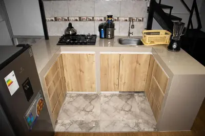 a kitchen with a sink and a counter top at La Almudena hogar tranquilo y acogedor in Cusco