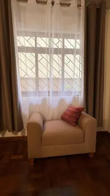 a couch sitting in front of a window at Casa Amplia en Miraflores in Lima