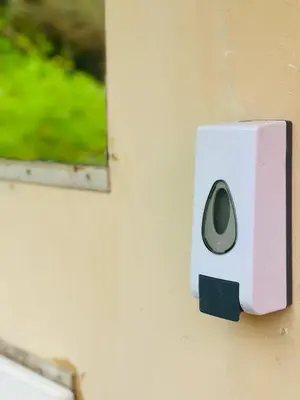 a white sensor on the side of a wall at Salkantay Glamp in Colcapampa