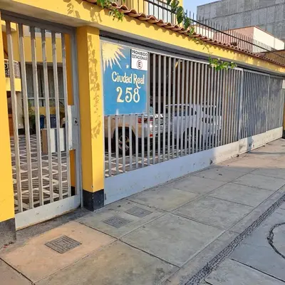 a store front with a gate with a sign on it at Classy Andino & primer piso, 2 dormitorios in Lima