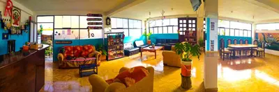 a living room with couches and chairs in a room at Mountainview House Ollantaytambo in Ollantaytambo