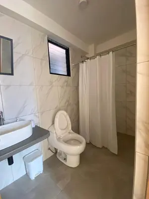 a bathroom with a toilet and a sink and a shower at Casa Moriáh in Maras