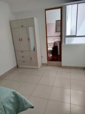 a white room with a bathroom with a sink and a mirror at Apartamento entero en Ayacucho in Ayacucho