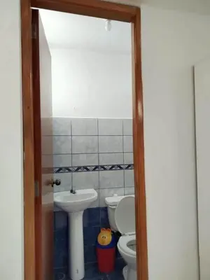 a bathroom with a toilet and a sink at Apartamento entero en Ayacucho in Ayacucho