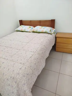 a small bedroom with a bed with a blanket at Apartamento entero en Ayacucho in Ayacucho