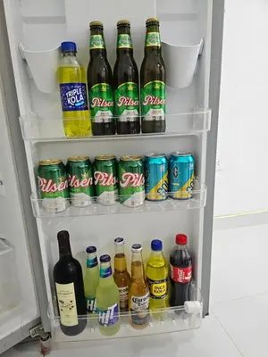 a refrigerator filled with lots of different types of drinks at PIERO HOUSE - La Merced in La Merced