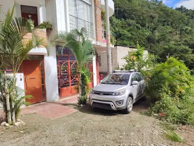 a car parked in front of a house at PIERO HOUSE - La Merced in La Merced