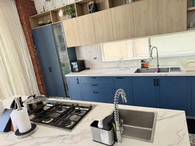 a kitchen with a sink and a stove top oven at Casa Chocaya Playa Campo in Fundo Copacabana