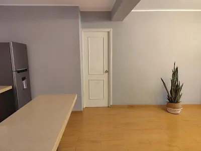 a kitchen with a counter top and a refrigerator at Apartamento Limas Airport in Lima