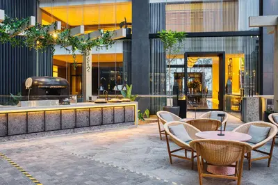 a restaurant with tables and chairs in a building at InterContinental Real Lima Miraflores by IHG in Lima
