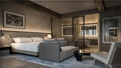 a bedroom with a bed and a couch and a chair at InterContinental Real Lima Miraflores by IHG in Lima