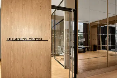a building with a business center sign on a wall at InterContinental Real Lima Miraflores by IHG in Lima