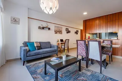 a living room with a couch and a table at GRM302 Apt Moderno 2 DRM with KING Bed in Miraflores in Lima