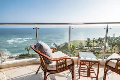 a balcony with a view of the ocean at M1001 - Malecon Seaview 2BDR Miraflores in Lima
