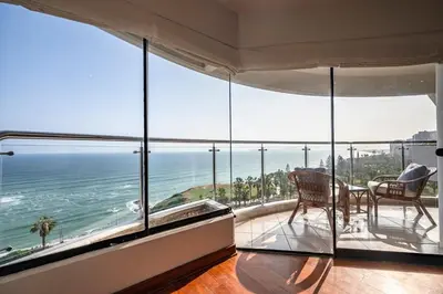 a living room with a view of the ocean at M1001 - Malecon Seaview 2BDR Miraflores in Lima