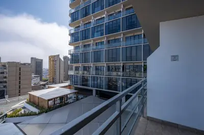 a view of a building from a balcony at Alcanfores - Tu Escapada Urbana Perfecta in Lima