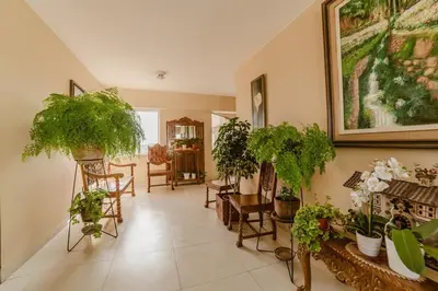 a room with a bunch of potted plants on the walls at GRM1601 Modern 1 BDR with skyline views from Miraflores in Lima