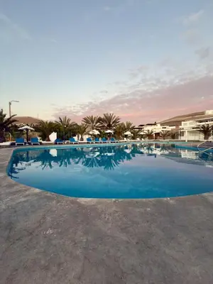 a large pool with blue water in a resort at Beach house Sol Mar y Relax in Cerro Azul