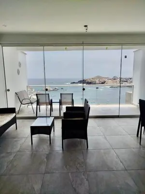a living room with a view of the ocean at Excellent view of Mar San Bartolo in San Bartolo
