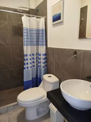 a bathroom with a toilet and a sink at Excellent view of Mar San Bartolo in San Bartolo