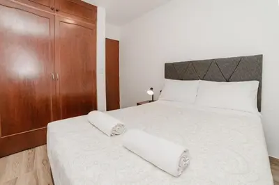 a bedroom with a bed with two towels on it at GRM308 Bright 2BR with BIG Terrace in Heart of Miraflores in Lima