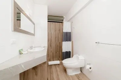 a bathroom with a toilet and a sink at GRM308 Bright 2BR with BIG Terrace in Heart of Miraflores in Lima